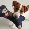joules-plush-bone-dog-toy-navy-floral-lifestyle